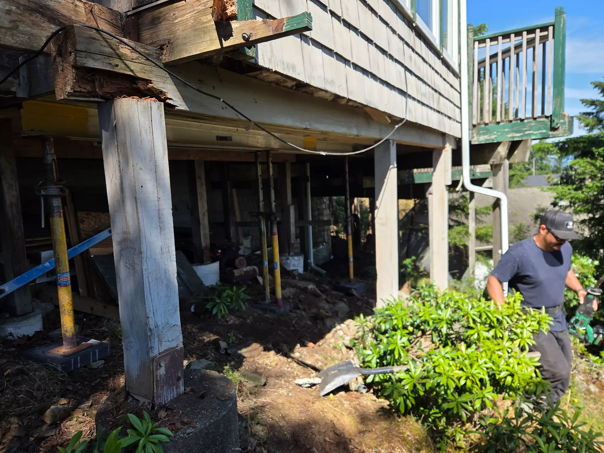 Structural repair work in progress on Vancouver Island — exposed floor joists and framing
